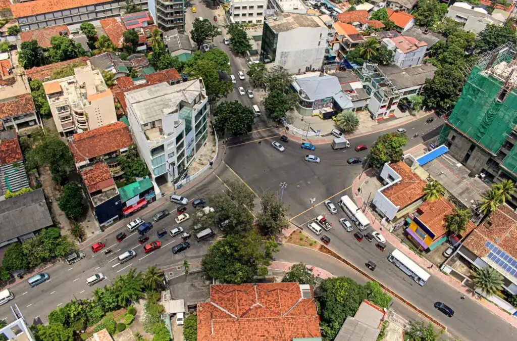 Aerial view of Colombo City, traffic light and cars on the road, neighborhood from top, city living