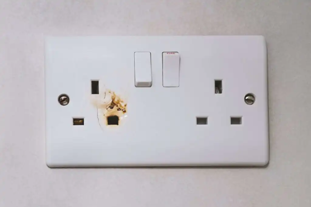 Broken power overload switch electric outlet