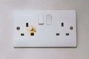 Broken power overload switch electric outlet