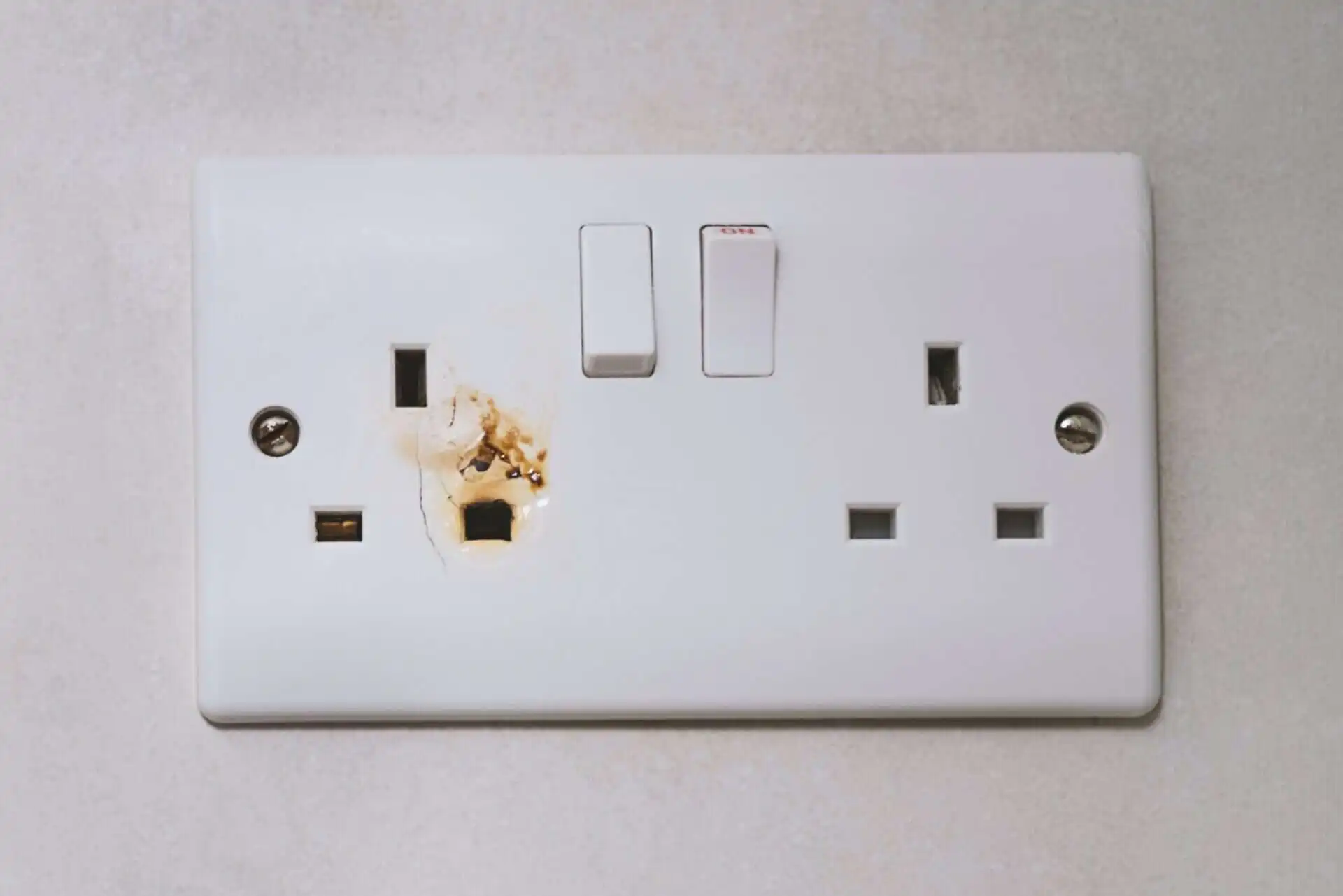 Broken power overload switch electric outlet