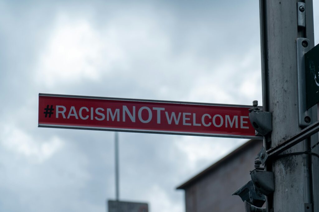 sign in the city saying Racism not welcome