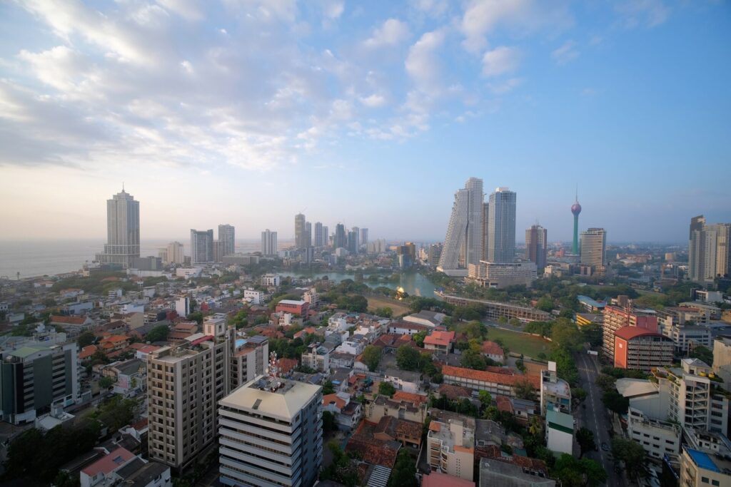 Colombo day time cityscape with view of Beira Lake surrounded by many large businesses